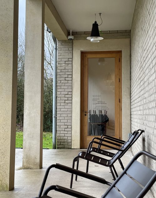 adf-web-magazine-outdoor-seats-to-enjoy-the-garden-view-and-umbrellas-to-borrow-before-exiting-the-door